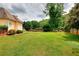 Spacious lawn and trees create an outdoor oasis in this backyard at 2726 Riderwood Ne Ln, Marietta, GA 30062