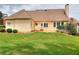 Side view of back of home with grass and trimmed bushes at 2726 Riderwood Ne Ln, Marietta, GA 30062