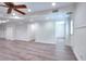 Finished basement with wood-look floors, white walls and trim, and a rear entry door at 2726 Riderwood Ne Ln, Marietta, GA 30062