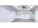 Spacious basement featuring built-in shelving, cabinets, and gray wood-look flooring at 2726 Riderwood Ne Ln, Marietta, GA 30062