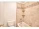 Bathroom with a tiled shower-tub and white toilet at 2726 Riderwood Ne Ln, Marietta, GA 30062