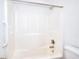 Bathroom shower and tub combination featuring a grab bar and white shower surround at 2726 Riderwood Ne Ln, Marietta, GA 30062