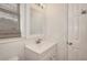 Bathroom featuring a vanity with a sink, white cabinets and framed mirror at 2726 Riderwood Ne Ln, Marietta, GA 30062