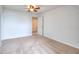 Neutral carpet lines this bedroom with bright white walls and a ceiling fan at 2726 Riderwood Ne Ln, Marietta, GA 30062