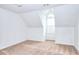 Bright bedroom featuring carpeted floors, an arched window, and white walls at 2726 Riderwood Ne Ln, Marietta, GA 30062