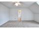 Bright, carpeted bedroom with a ceiling fan and white walls at 2726 Riderwood Ne Ln, Marietta, GA 30062