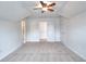 Bedroom featuring a ceiling fan, neutral carpet and multiple closet doors at 2726 Riderwood Ne Ln, Marietta, GA 30062