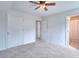 Bright bedroom with carpeted floors and multiple doors at 2726 Riderwood Ne Ln, Marietta, GA 30062