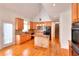 Kitchen featuring wooden cabinets, granite counters, island, and modern appliances at 2726 Riderwood Ne Ln, Marietta, GA 30062