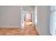 Bright living room with hardwood floors, white walls, and French doors creating a seamless flow between spaces at 2726 Riderwood Ne Ln, Marietta, GA 30062