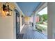 Welcoming porch featuring classic columns, outdoor lighting, and a well-maintained wooden floor at 2726 Riderwood Ne Ln, Marietta, GA 30062