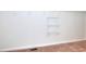 Walk-in closet with wall-mounted storage shelves and carpeting at 2726 Riderwood Ne Ln, Marietta, GA 30062