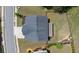 Aerial view showcasing the roof of a well-maintained home with a spacious backyard and neat landscaping at 3985 Starwood Dr, Cumming, GA 30028