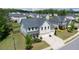 Aerial view of a beautiful two-story house with a well-manicured lawn and a three car garage at 3985 Starwood Dr, Cumming, GA 30028