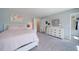 Bedroom featuring light grey walls and neutral carpet with a large window at 3985 Starwood Dr, Cumming, GA 30028