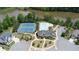 Aerial view featuring a community pool, tennis courts, and clubhouse in a serene lakeside setting at 3985 Starwood Dr, Cumming, GA 30028