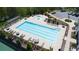 Community pool with lap lanes and lounge area, surrounded by lush greenery and convenient parking at 3985 Starwood Dr, Cumming, GA 30028