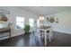 Dining room features include an eat sign, rustic decor and matching white chairs and table at 3985 Starwood Dr, Cumming, GA 30028