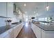 Bright kitchen features granite counters, modern stainless steel appliances, and hardwood floors at 3985 Starwood Dr, Cumming, GA 30028