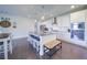 Modern kitchen featuring an island, stainless steel appliances, and a adjacent dining area at 3985 Starwood Dr, Cumming, GA 30028