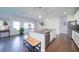 Modern kitchen featuring a granite island, stainless steel appliances, and an adjacent dining area at 3985 Starwood Dr, Cumming, GA 30028