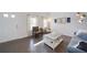 Bright living room featuring hardwood floors, neutral paint, and modern furnishings for a welcoming atmosphere at 3985 Starwood Dr, Cumming, GA 30028