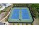Aerial view of well-maintained community tennis courts with professional lighting and surrounding landscape at 3985 Starwood Dr, Cumming, GA 30028