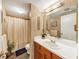 Well-maintained bathroom with a vanity, mirror, and shower, offering functionality and comfort in a cozy setting at 4118 Stillwater Dr, Duluth, GA 30096