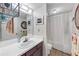 Traditional bathroom featuring a sink, mirror, shower and patterned floor at 4118 Stillwater Dr, Duluth, GA 30096