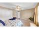 Bright bedroom features a ceiling fan, plush carpet, and neutral walls, creating a peaceful and inviting retreat at 4118 Stillwater Dr, Duluth, GA 30096