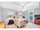 Cozy bedroom with carpet flooring, ceiling fan, and natural light, perfect for restful nights and peaceful mornings at 4118 Stillwater Dr, Duluth, GA 30096