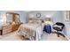 Spacious bedroom with large windows, ceiling fan, and neutral decor, providing a tranquil and inviting atmosphere at 4118 Stillwater Dr, Duluth, GA 30096