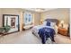 Comfortable bedroom with neutral tones, carpet floors, and a large mirror, creating a bright and open space at 4118 Stillwater Dr, Duluth, GA 30096