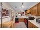 Well-equipped kitchen with stainless steel appliances and wood cabinets at 4118 Stillwater Dr, Duluth, GA 30096