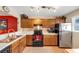Well-equipped kitchen with stainless steel appliances and wood cabinets at 4118 Stillwater Dr, Duluth, GA 30096
