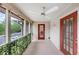 Charming patio with overhead fan and privacy foliage, offering a serene outdoor space for relaxation and enjoyment at 4118 Stillwater Dr, Duluth, GA 30096