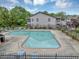 Inviting community pool surrounded by lounge chairs and lush greenery at 4118 Stillwater Dr, Duluth, GA 30096