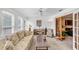 Bright sunroom with large windows, a ceiling fan, and sliding glass doors at 4118 Stillwater Dr, Duluth, GA 30096
