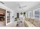 Inviting sunroom features bright light, a ceiling fan, and glass doors that lead to an adjacent room at 4118 Stillwater Dr, Duluth, GA 30096