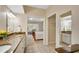 Bright bathroom featuring granite countertops, double sinks, vanity lighting, and access to main bedroom at 404 Carryback Dr, Marietta, GA 30068