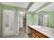 Bathroom with a long vanity, an oversized mirror and doorways to the shower and the hall at 404 Carryback Dr, Marietta, GA 30068