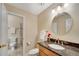 A bathroom featuring granite countertops, a single sink, and a tiled shower at 404 Carryback Dr, Marietta, GA 30068