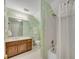 Bathroom featuring a vanity, mirror, and bathtub with shower at 404 Carryback Dr, Marietta, GA 30068