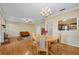 Elegant dining area with hardwood floors, a chandelier, and access to other rooms at 404 Carryback Dr, Marietta, GA 30068