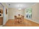 Cozy dining area with hardwood floors, a chandelier, and a window with a view at 404 Carryback Dr, Marietta, GA 30068