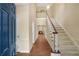 Inviting foyer with soaring ceilings, staircase, and hardwood floors at 404 Carryback Dr, Marietta, GA 30068