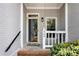 Inviting front porch featuring brick steps and white railing at 404 Carryback Dr, Marietta, GA 30068
