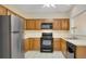 Functional kitchen with stainless steel refrigerator and oak cabinets at 404 Carryback Dr, Marietta, GA 30068