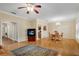 Spacious living room with hardwood floors, dining area, fireplace, and plenty of natural light at 404 Carryback Dr, Marietta, GA 30068