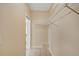 A walk-in closet featuring tile flooring, painted walls, and white shelving at 404 Carryback Dr, Marietta, GA 30068